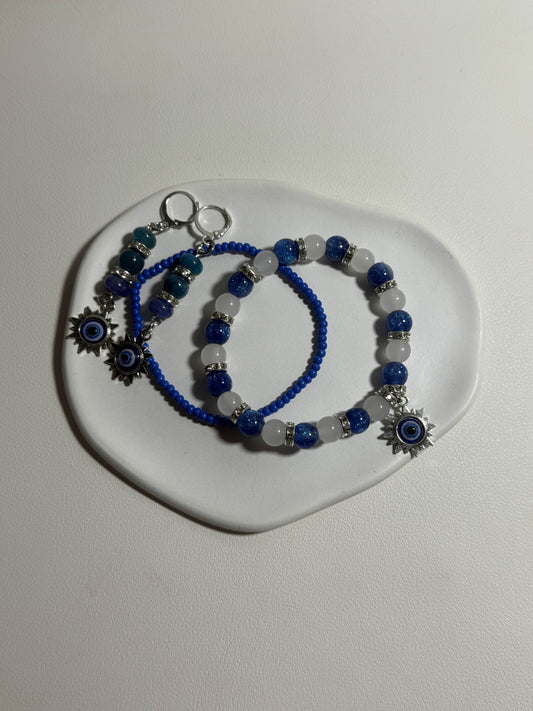 Blaue Schutzschmuck-Kollektion „Auge des Meeres“